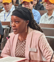 Manna representative testifying in support of the FT25 budget