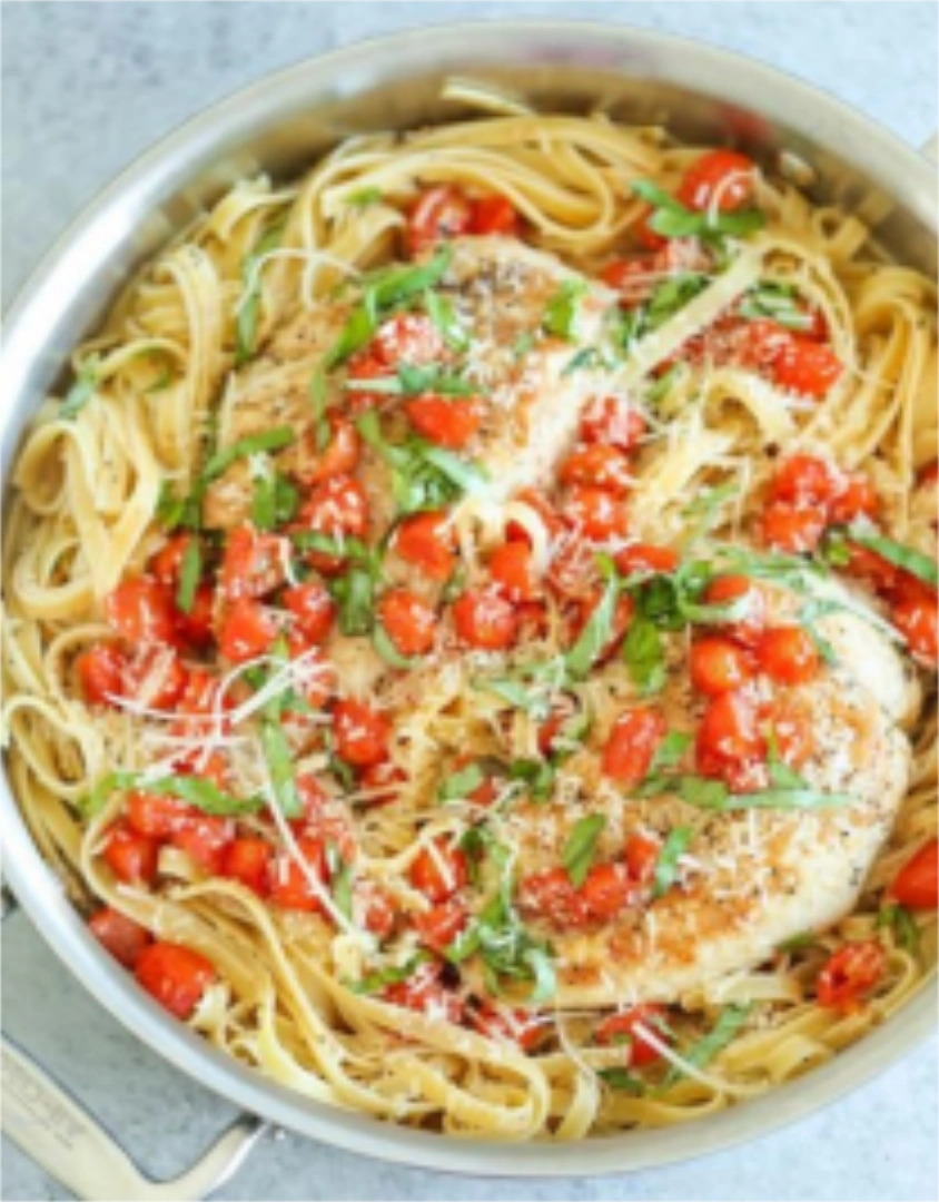 Chicken and basil on a bed of whole wheat pasta