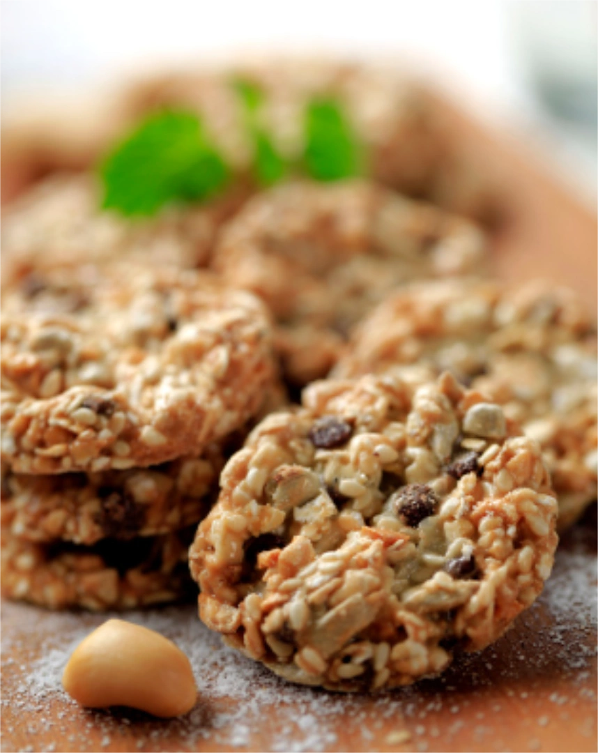 A pile of cookies with a dusting of powdered sugar underneath them