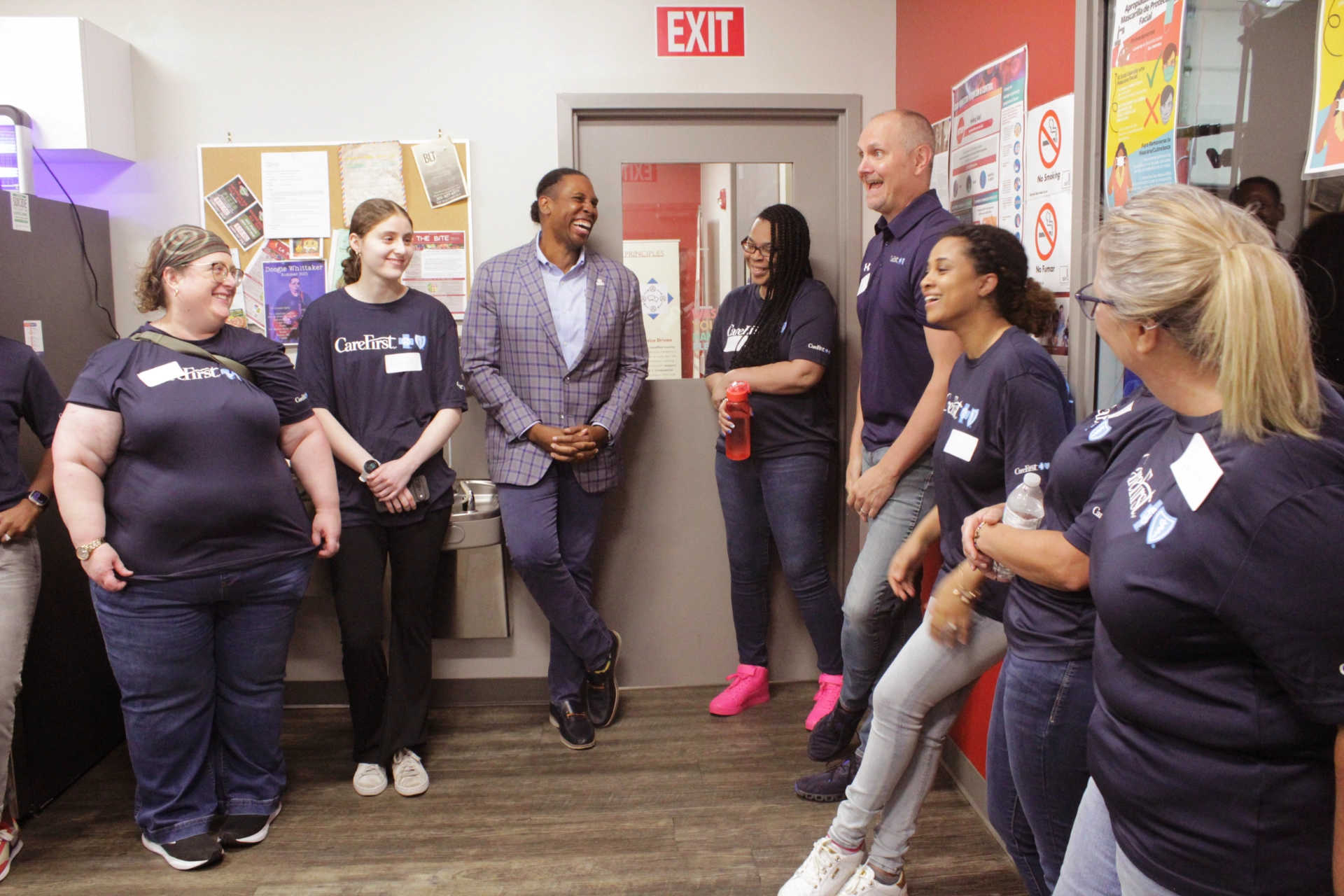 Craig Rice talking with group of volunteers from CareFirst
