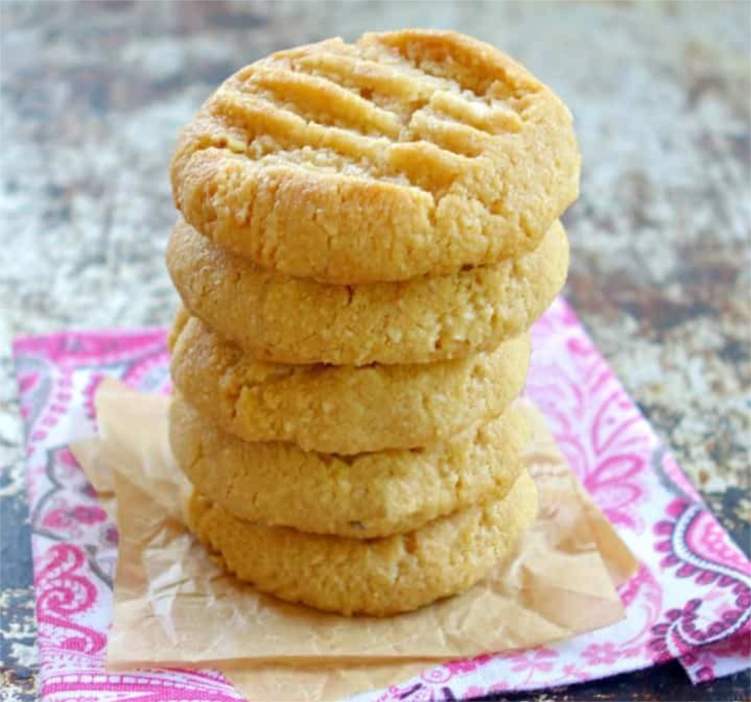 A stack of five lemon ginger cookies on a napkin