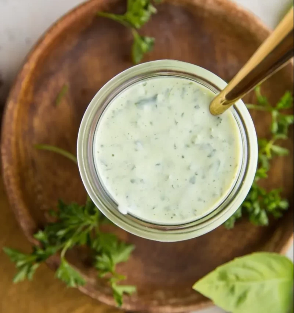 Overhead shot of green goddess salad dressing in serving dish