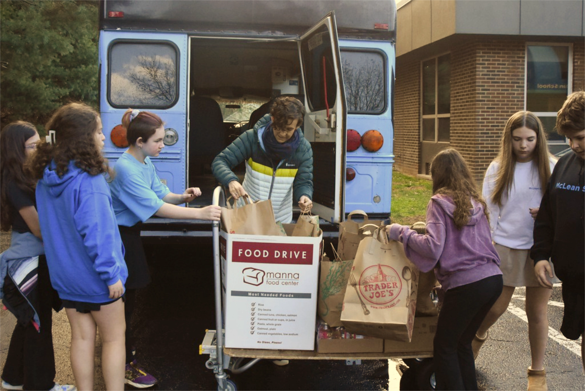 School-aged children collecting food drive donations for Manna truck