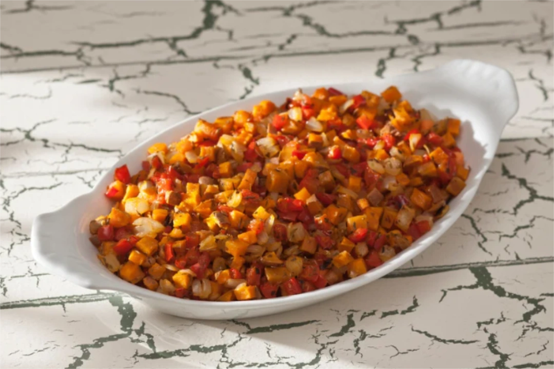 Sweet potato hash on a white casserole dish