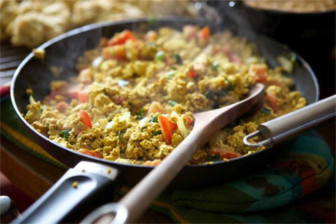 A skillet full of sizzling tofu scramble
